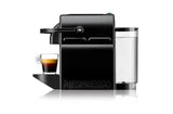 Black coffee machine with a glass carafe and a small cup of coffee on a white background