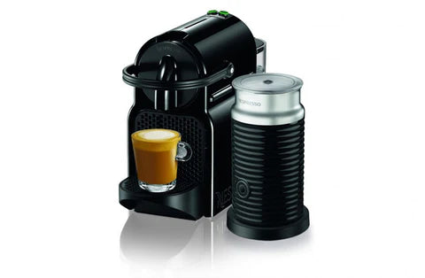 Black coffee machine with a glass of coffee on a white background